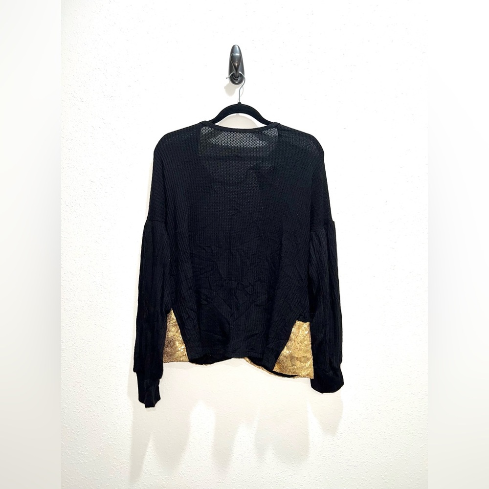 Sequin cross backed blouse.